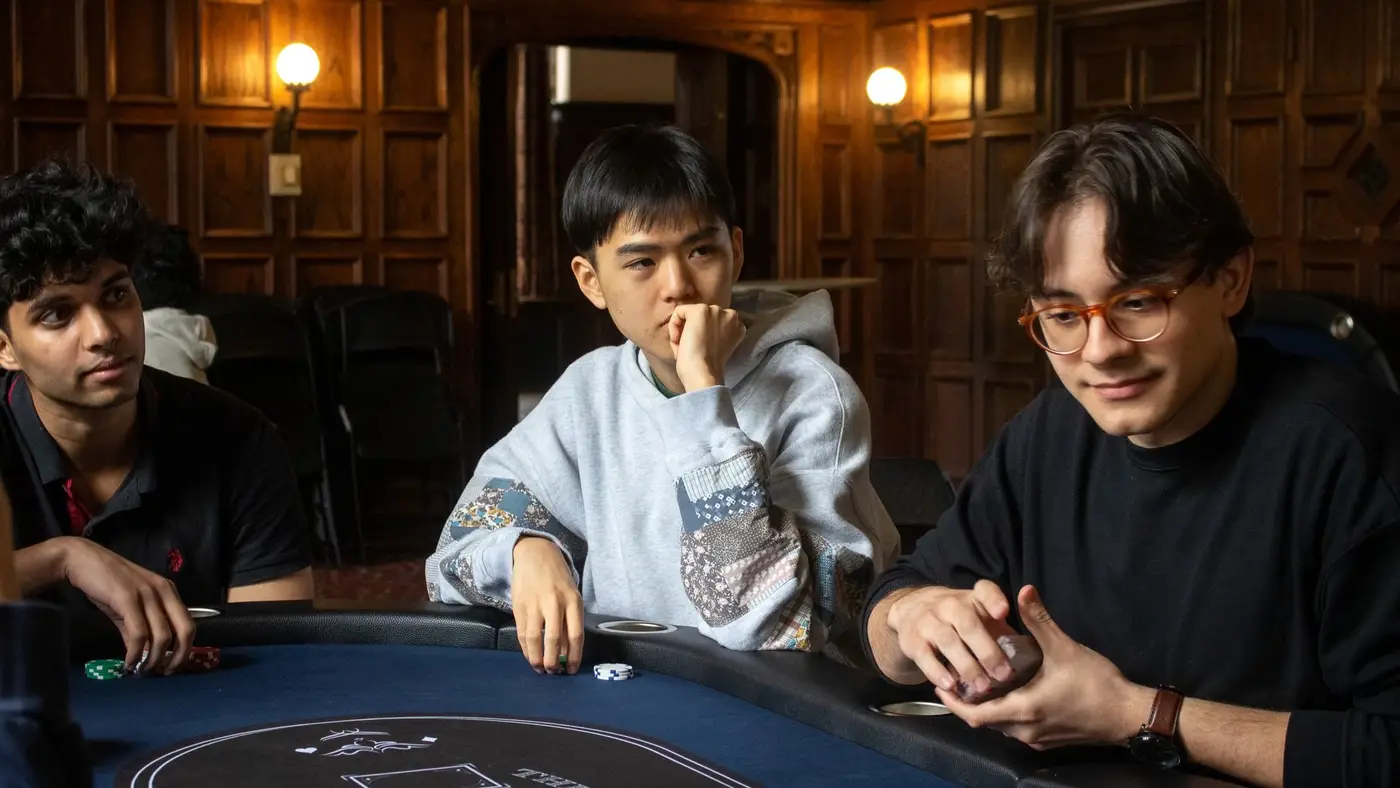 Three members at the table during a club game